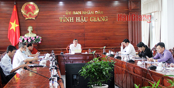 Cuộc họp tại điểm cầu trực tuyến UBND tỉnh Hậu Giang.
